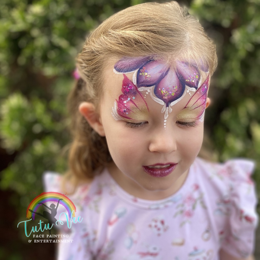 Dragon face paint on a boy