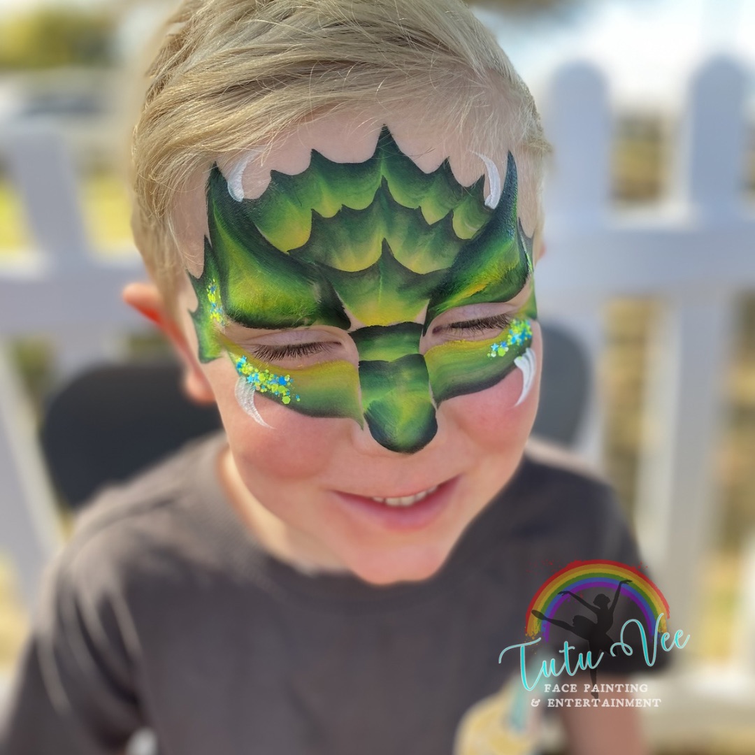 Rainbow heart butterfly face paint on a girl